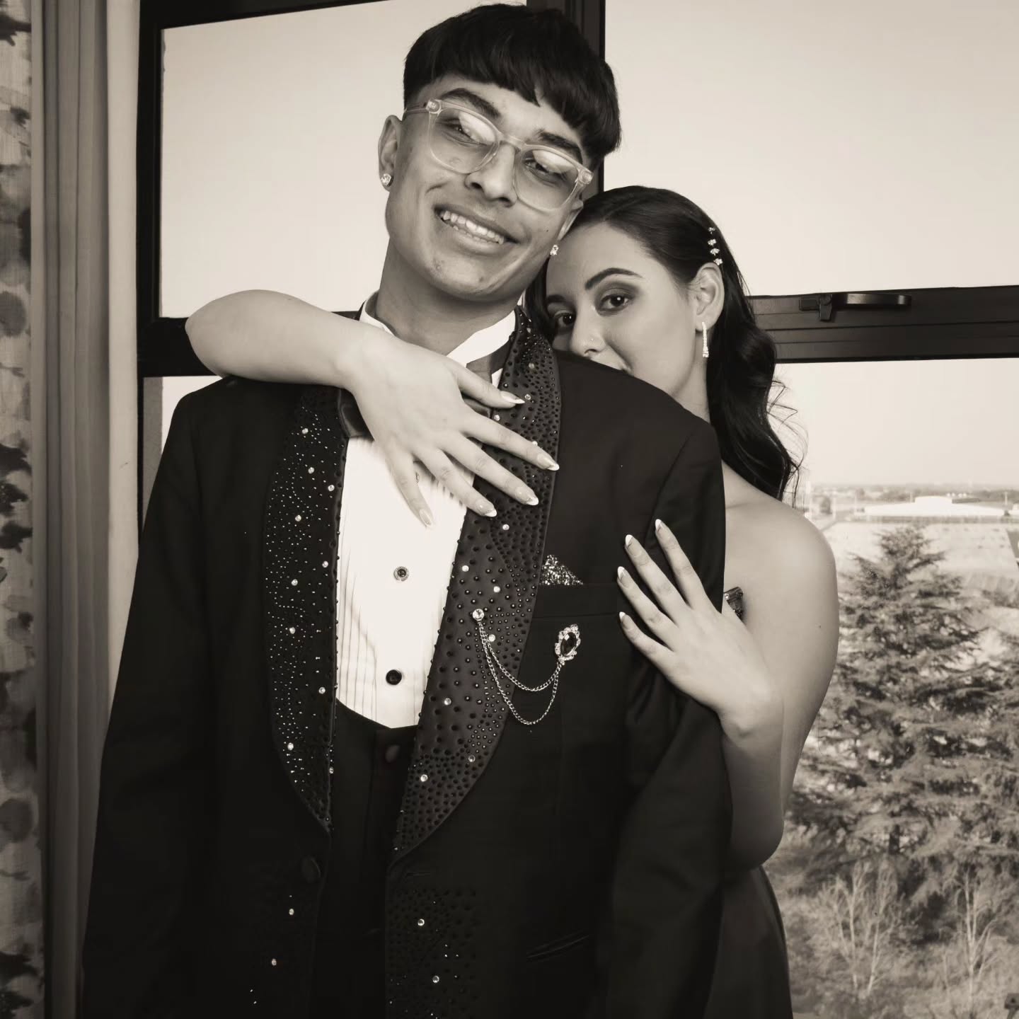 Black and white couple portrait: head resting on a shoulder